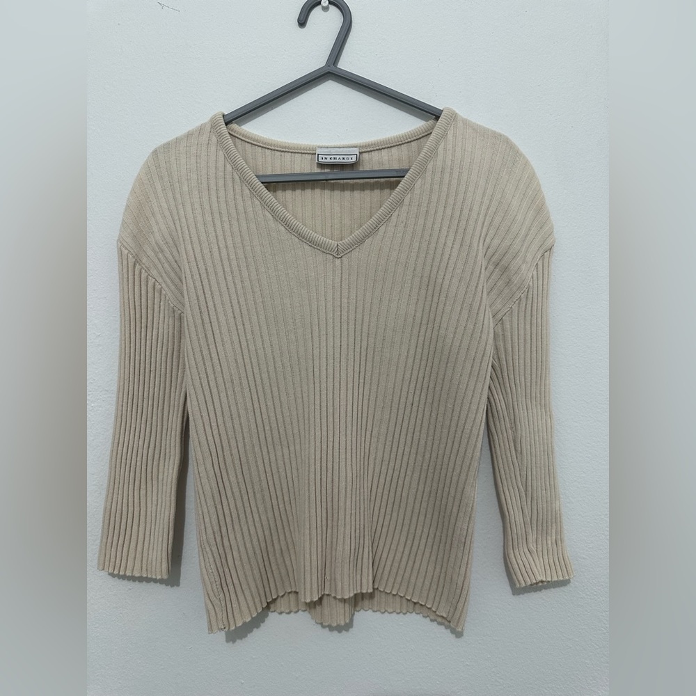 Tan long sleeve top with V- neck. Stretch material